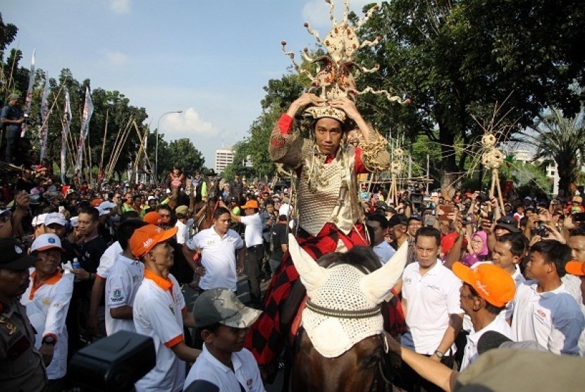 Governor of Jakarta Joko Widodo or Jokowi rides a horse and wears carnival costume during an opening of Jakarnaval in Jakarta on Sunday. 