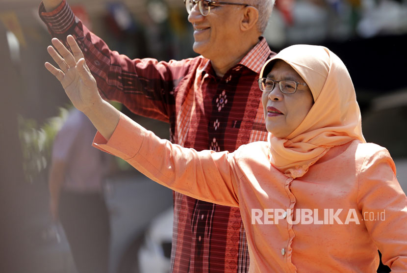 Halimah Yacob and husband Mohammad Abdullah Alhabshee. Halimah was elected unopposed as Singapore first woman president.