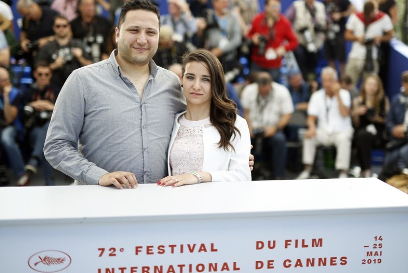 Hamza Al-Khateab (kiri) dan Waad Al-Khateab (kanan) di Festival Film Cannes 2019. Sutradara Waad Al-Khateab selangkah lagi dekat dengan Oscar berkat film dokumenter For Sama. Ilustrasi. 