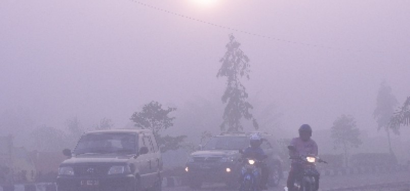 Haze limits visibility in some area in Indonesia forest fire or land clearing using fire, last year.