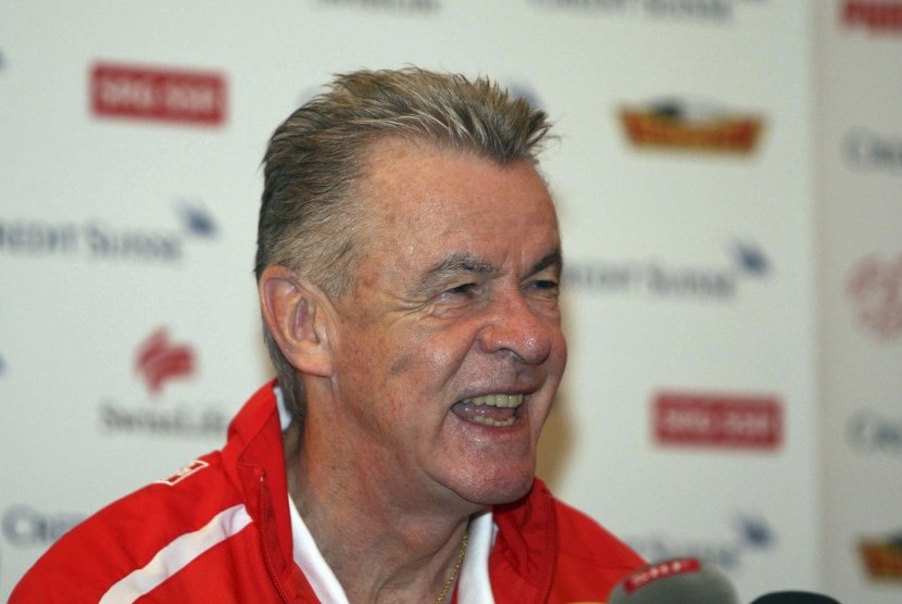 Hitzfeld, coach of the Swiss national soccer team, smiles during a news conference in Tirana