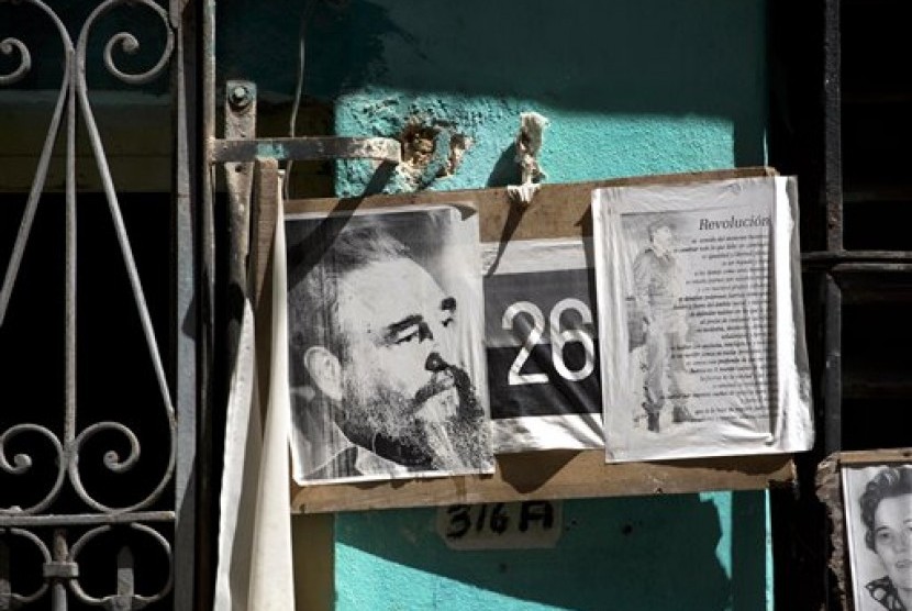 Images of Cuba's former leader, Fidel Castro, adorn a wall of a home in Havana, Cuba, Wednesday, Aug. 28, 2013.