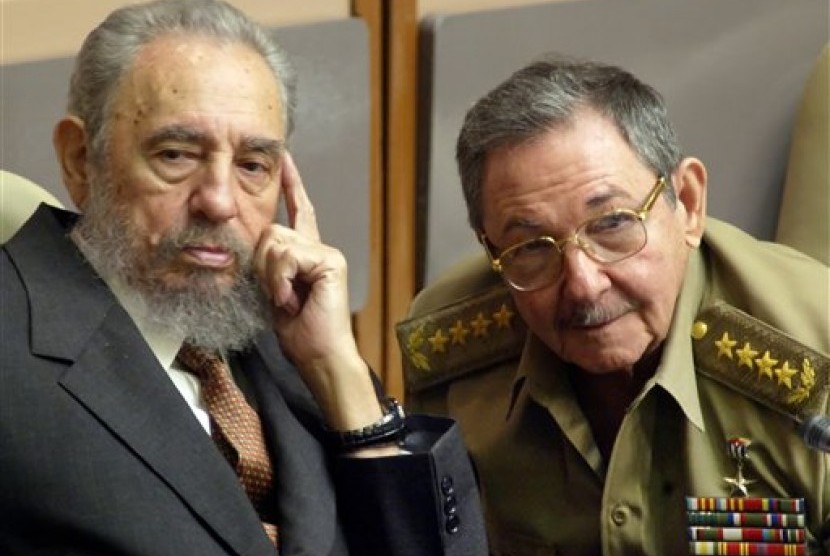 In this July 31, 2004 file photo, Cuba's President Fidel Castro (left) and his brother, Minister of Defense Raul Castro, attend a Parliament session in Havana, Cuba. 
