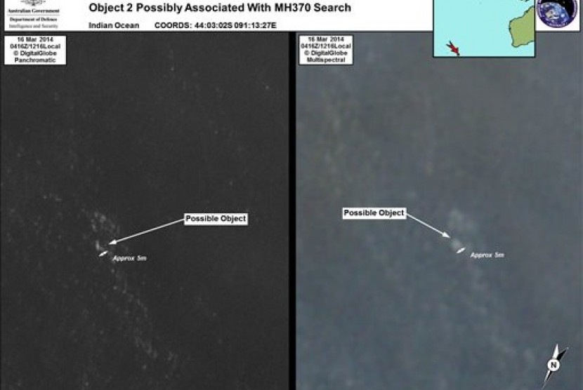 In this March 16, 2014 satellite imagery provided by Commonwealth of Australia - Department of Defence on Thursday, March 20, 2014, a floating object is seen at sea next to the descriptor which was added by the source. 