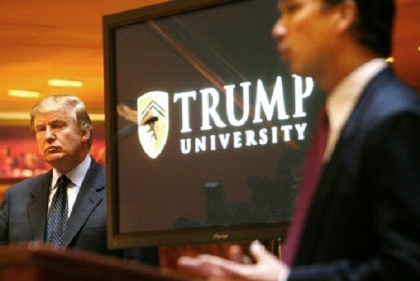 In this May 23, 2005 file photo, real estate mogul and Reality TV star Donald Trump, left, listens as Michael Sexton introduces him at a news conference in New York where he announced the establishment of Trump University. 