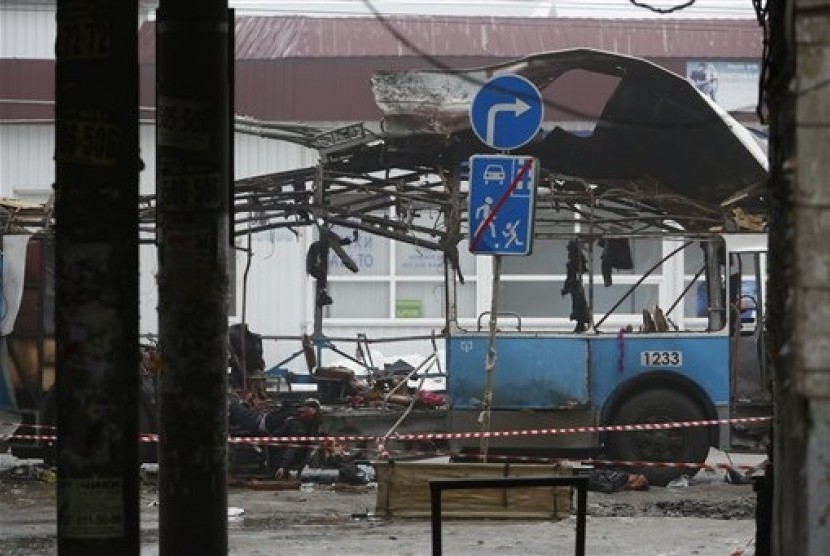 In this Monday, Dec. 30, 2013 file photo bodies of victims of a suicide bombing lie in what left of a trolleybus in downtown Volgograd, southern Russia. 