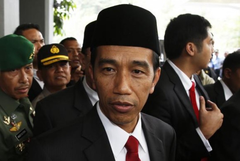 Indonesia's President-elect Joko Widodo looks on after a ceremony inaugurating a new parliament in Jakarta, October 1, 2014. 