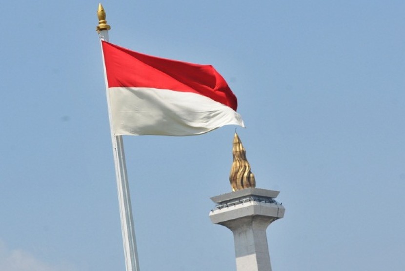 Indonesian flag with the National Monument in the background (illustration)