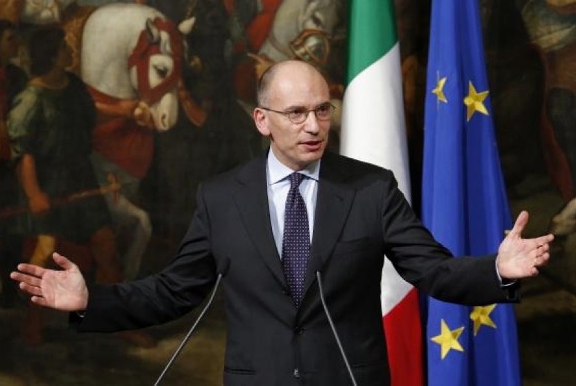 Italian Prime Minister Enrico Letta gestures during a news conference at Chigi Palace in Rome February 12, 2014.