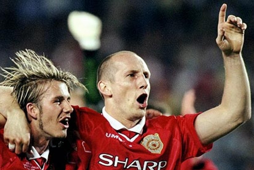 Jaap Stam dan David Beckham saat masih berkostum Manchester United.