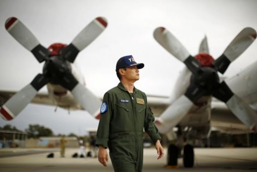 Japan's Maritime Self-Defence Force Commander Hidetsugu Iwamasa is pictured in front of one of their P-3C Orion aircraft currently at RAAF Base Pearce near Perth, April 4, 2014. 