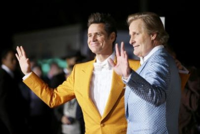 Jim Carrey dan Jeff Daniels saat pemutaran perdana Dumb and Dumber To awal bulan ini di Los Angeles.