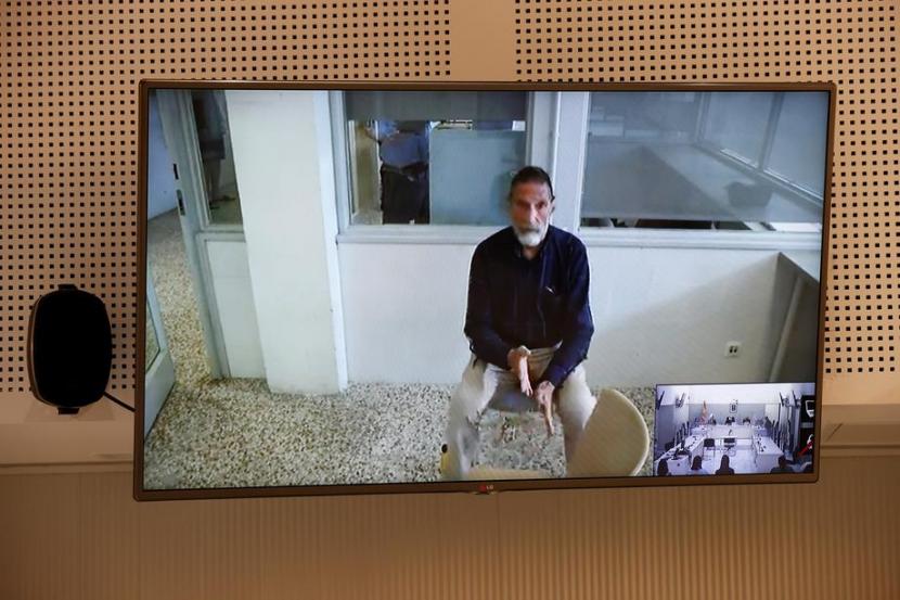 John McAfee, pencipta software antivirus McAfee, tampil melalui konferensi video saat pengadilan ekstradisinya di Madrid, Spanyol, 15 Juni 2021. John McAfee meninggal di penjara sepekan setelahnya. 