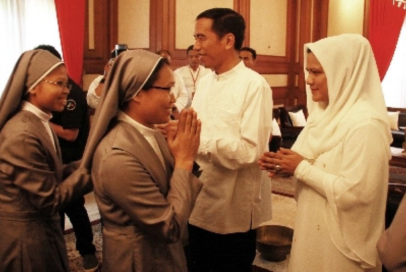 First Lady Iriana Widodo with President Jokowi