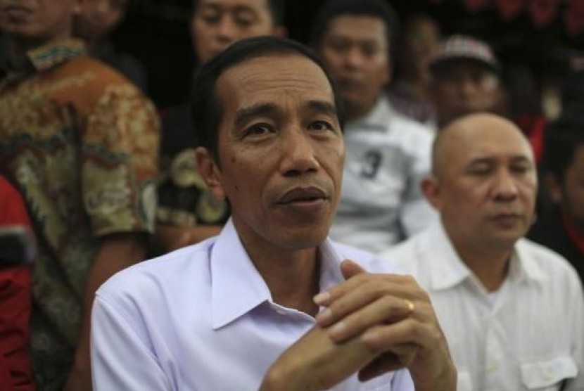 Joko Widodo looks on during PDIP party campaign in Jakarta March 16, 2014.