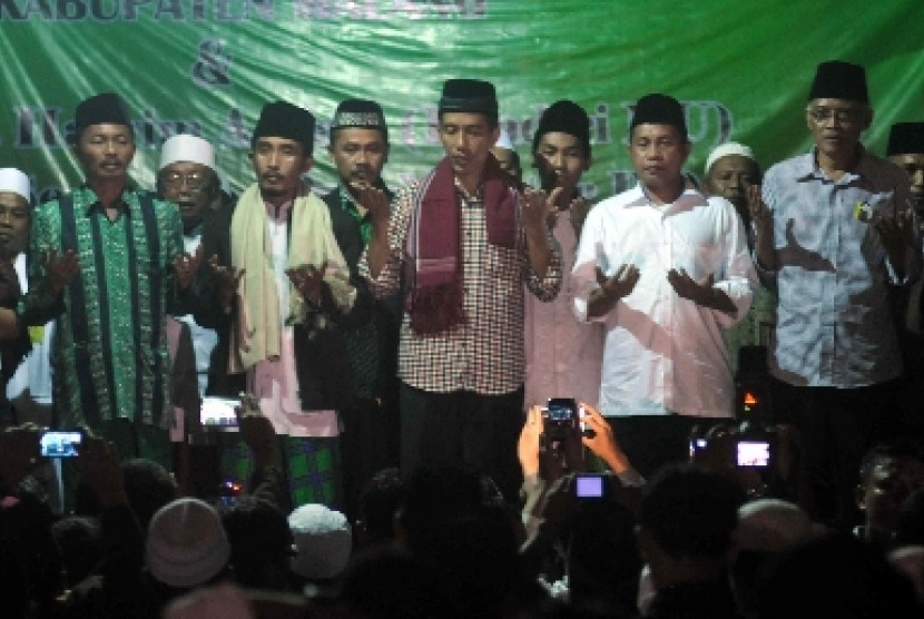 Jokowi ketika berjanji menetapkan 1 Muharram menjadi Hari Santri Nasional.