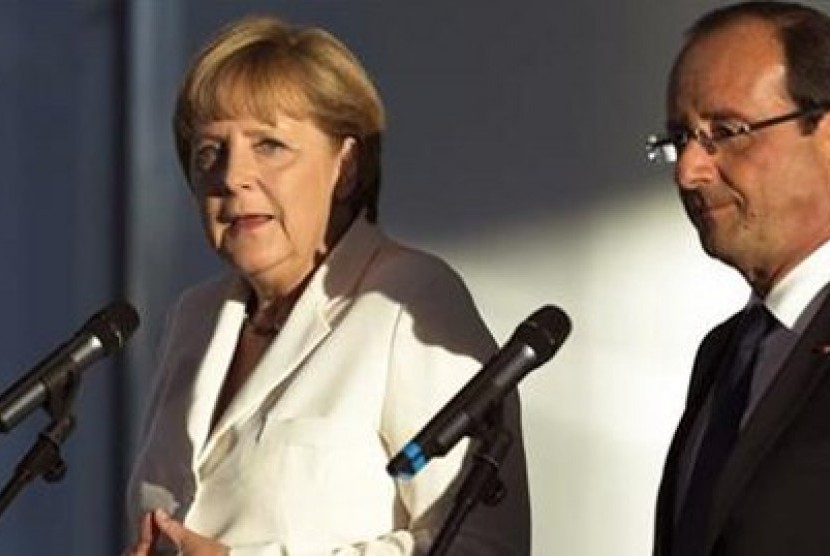 Kanselir Jerman, Angela Merkel (kiri) dan Presiden Prancis, Francois Hollande