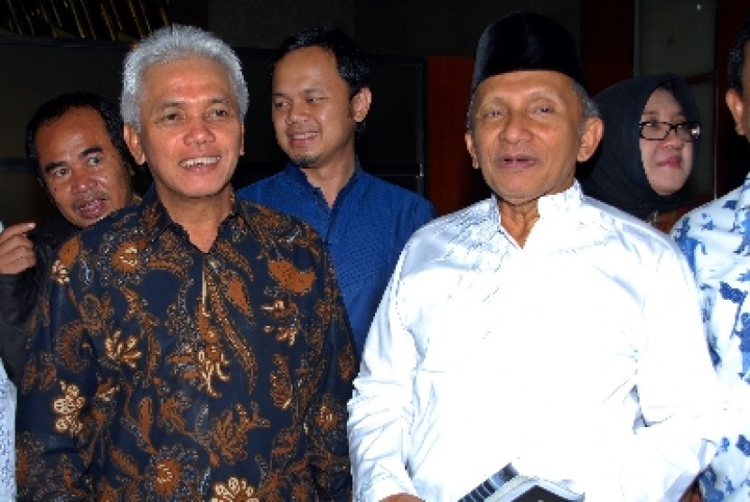 Ketua Umum PAN Hatta Rajasa (kiri) dan Dewan Pembina Amien Rais (kanan).