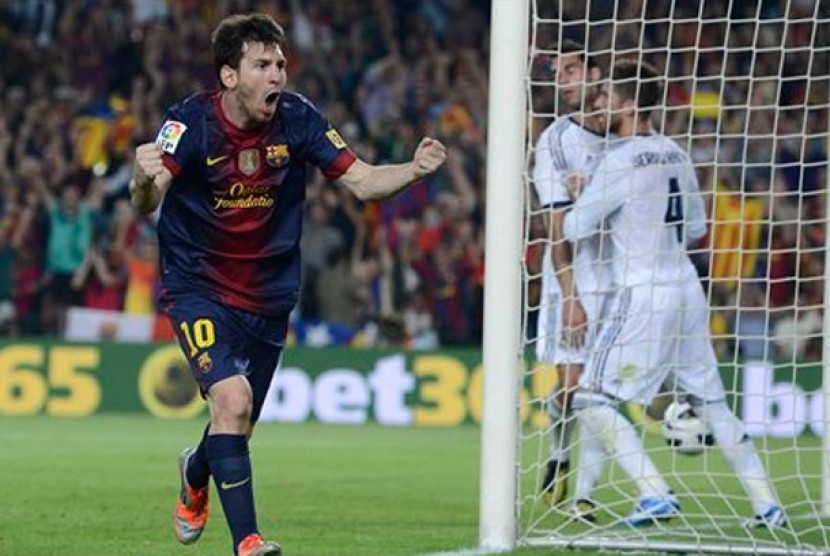 Lionel Messi merayakan gol ke gawang Real Madrid, Senin (8/10) dinihari WIB.