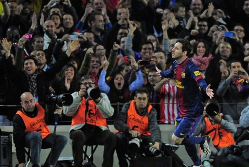 Lionel Messi usai mencetak gol ke gawang Atletico Madrid, Senin (17/12) dini hari.