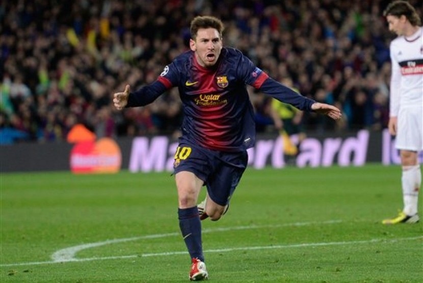 Lionel Messi usai mencetak gol kedua ke gawang AC Milan, Rabu (13/3) dini hari WIB.