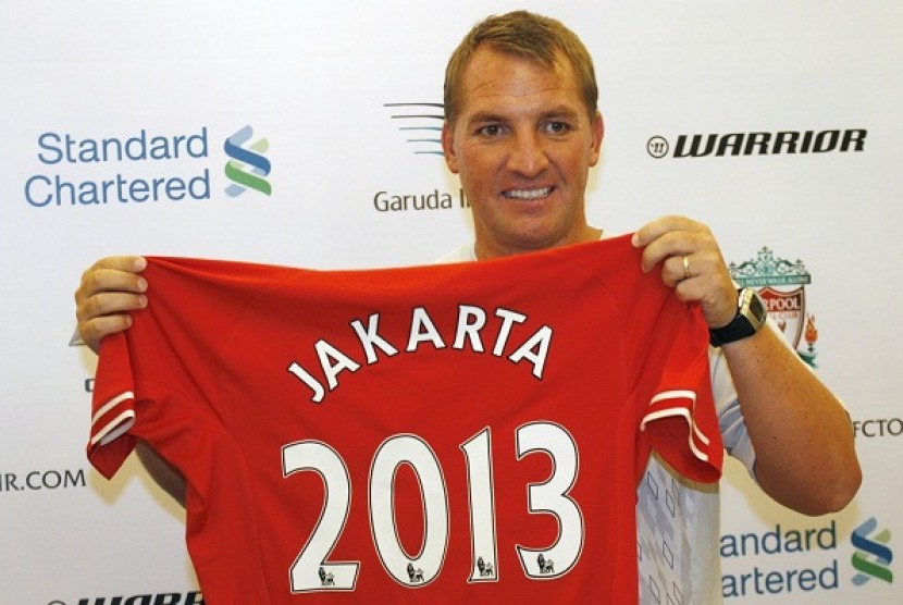 Liverpool's manager Brendan Rodgers holds a jersey during a press conference in Jakarta, Indonesia, Thursday, July 18, 2013. Liverpool is on the 2013 summer tour to Indonesia, Australia and Thailand.