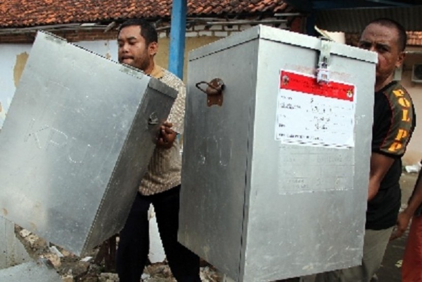 Local electoral committee members bring ballot boxes in Madura, East Java. (illustration)