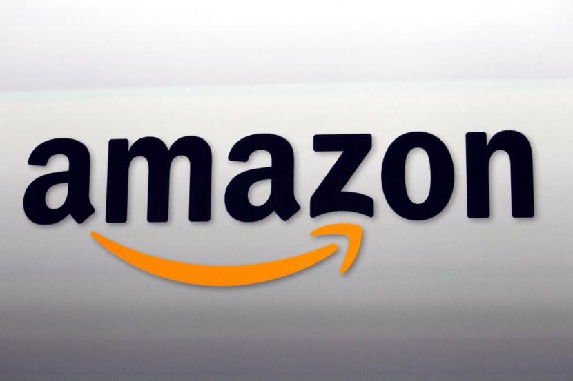 Logo Amazon. Lebih dari 700 karyawan gudang Amazon di Inggris melakukan mogok kerja sebagai bentuk protes terhadap ketidakpuasan gaji yang diterima.