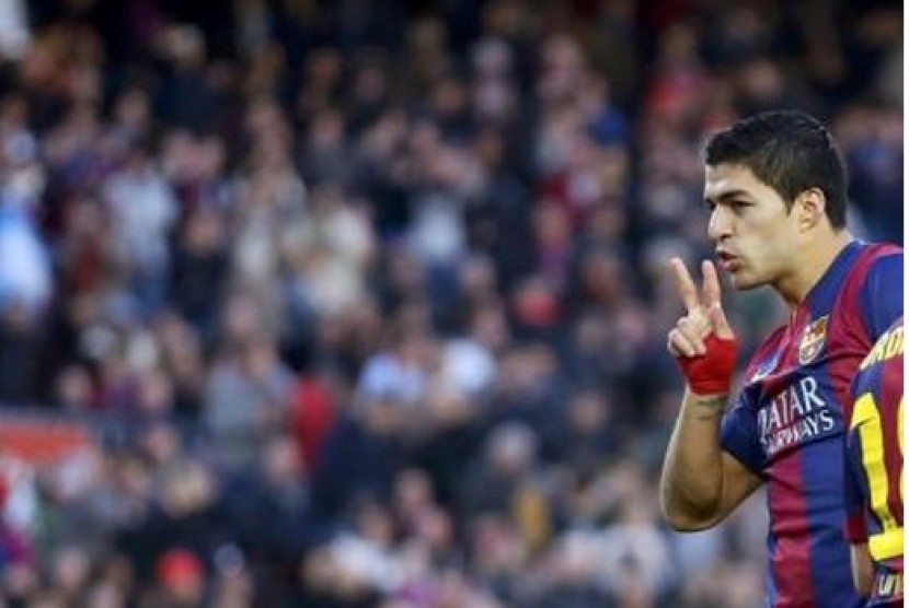 Luis Suarez saat merayakan golnya untuk Barcelona.