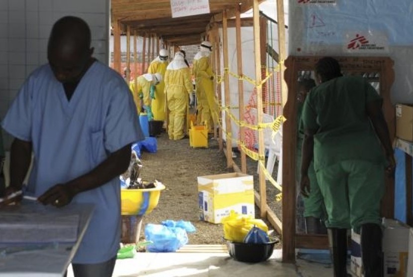 Medicins Sans Frontieres (MSF) health workers prepare at ELWA's hospital isolation camp during the visit of Senior United Nations (UN) System Coordinator for Ebola, David Nabarro, in Monrovia August 23, 2014.