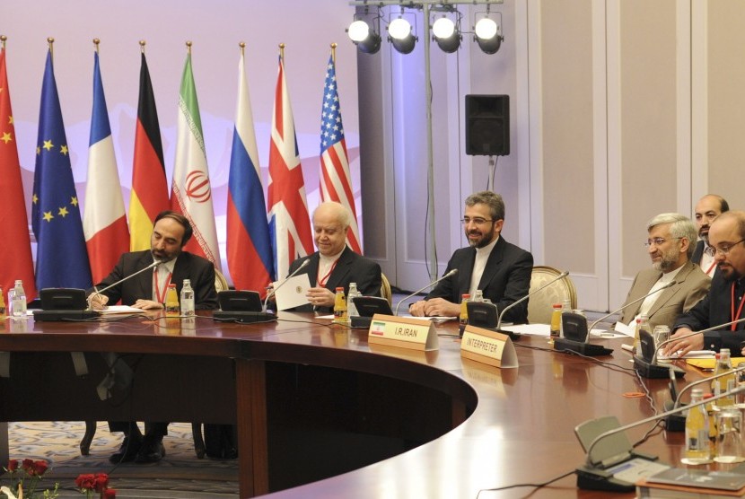 Members of the Iranian delegation, led by Supreme National Security Council Secretary and chief nuclear negotiator Saeed Jalili (second right), sit at a table during talks in Almaty, on Tuesday.  