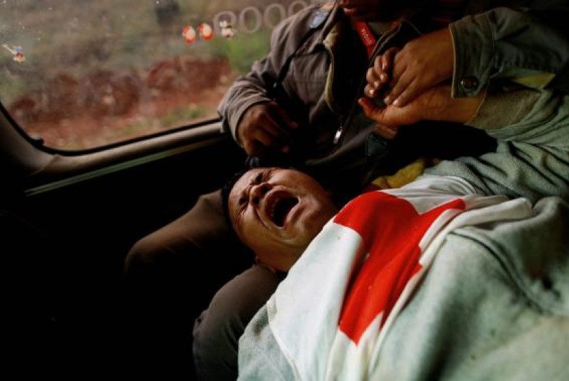 Moe Kyaw Than, 45, a volunteer with the Myanmar Red Cross Society reacts after he was wounded when the convoy he was in, was fired upon by the Myanmar National Democratic Alliance Army (MNDAA), according to the Myanmar army, between the capital of Kokang, 