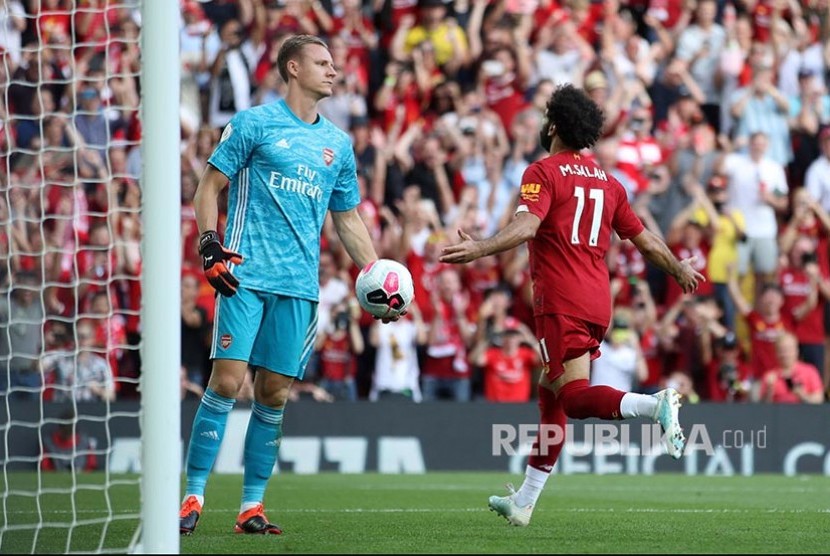 Mohamed Salah merayakan gol pada laga Liga Inggris di Stadion Anfield, Liverpool, Ahad dinihari (24/8).
