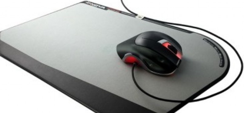 Mouse di atas mousepad (ilustrasi)