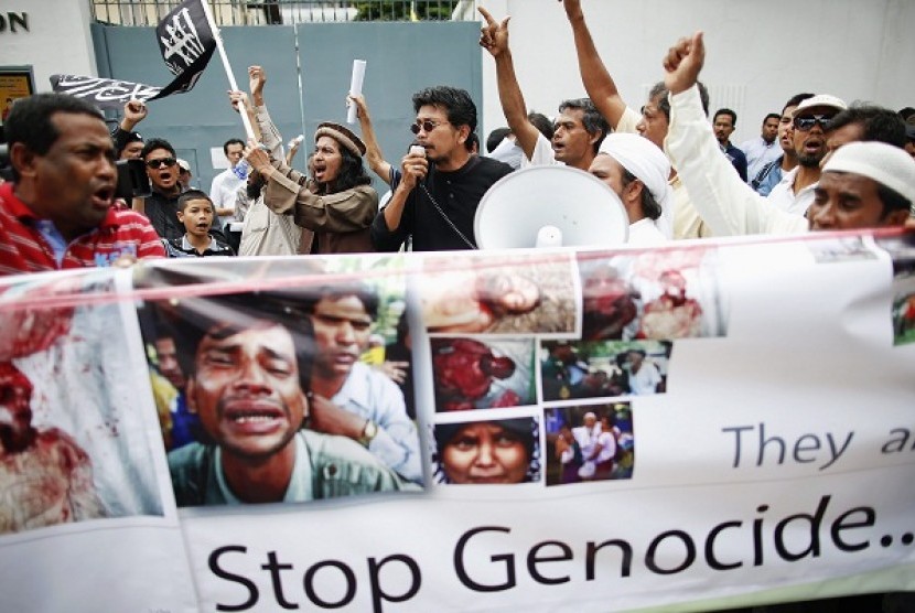 Muslims hold pictures and banners as they protest in front of Myanmar's embassy in Bangkok in June. A group of Rohingyas living in Thailand and other Muslims gathered outside the embassy demanding security for Myanmar's Rohingya people and called for inter
