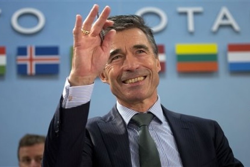 NATO Secretary General Anders Fogh Rasmussen gestures during a meeting of the North Atlantic Council at NATO headquarters in Brussels on Tuesday, April 1, 2014. 