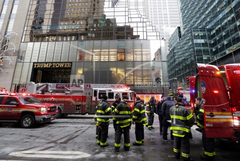 New York City Fire Department vehicles sit on Fifth Avenue in front of Trump Tower, in New York, Monday, Jan. 8, 2018. The department says the fire started around 7 a.m. Monday in the heating and air conditioning system of the building on Fifth Avenue in Manhattan.