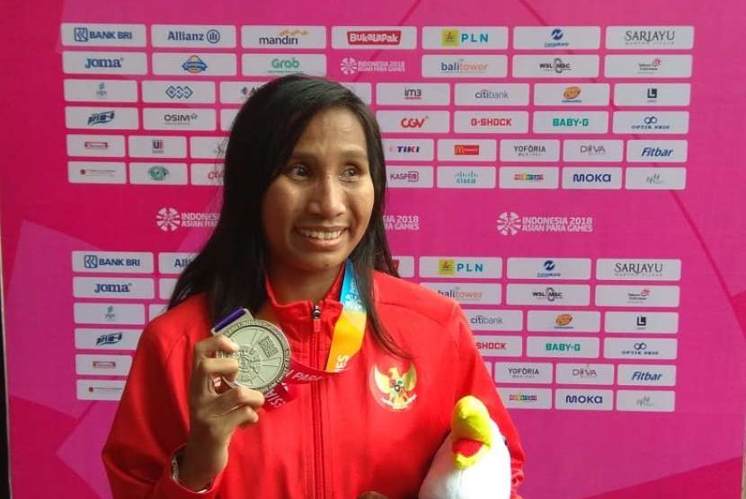 Ni Made Arianti Putri sumbang perak lagim kali ini dari nomor 400 meter putri kategori T13. Kemarin gadis asal Bali ini meraih perak di nomor 100 meter.