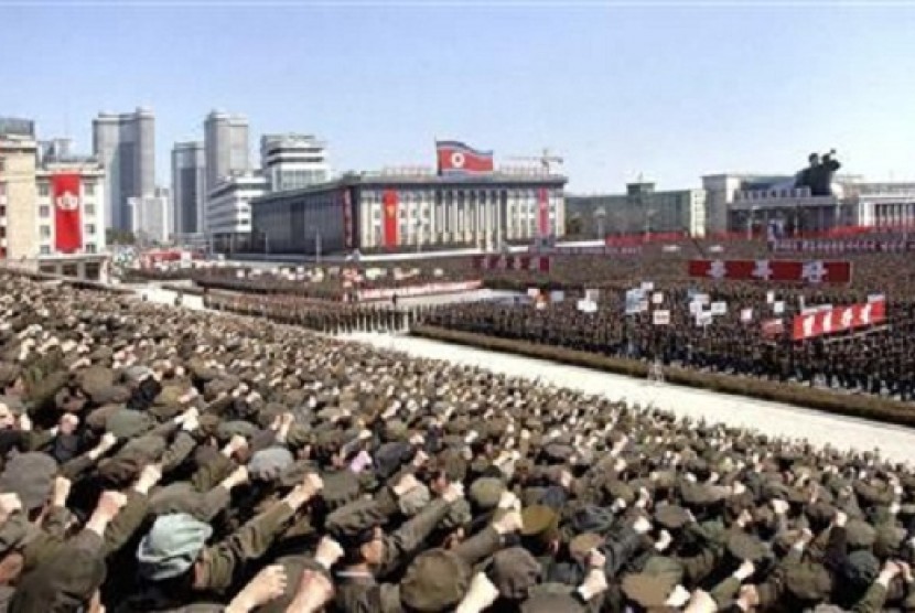 North Koreans including soldiers attend a rally in support of North Korean leader Kim Jong-un's order to put its missile units on standby in preparation for a possible war against the US and South Korea, in Pyongyang, March 29, 2013.