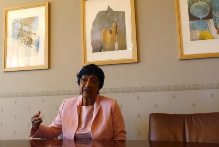 Outgoing UN Human Rights Commissioner Navi Pillay talks during an interview to Reuters in her office in Geneva August 19, 2014.