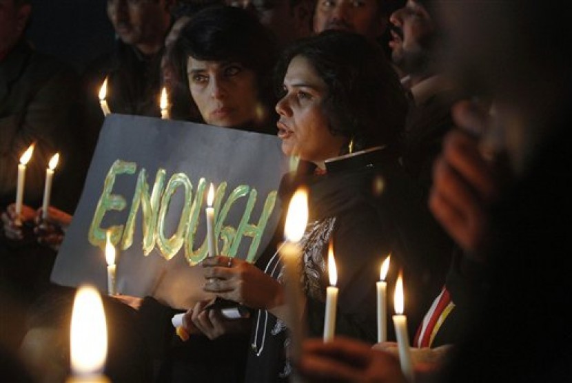 Pakistani civil society members take part in a candle light vigil for the victims of a school attacked by the Taliban in Peshawar, Tuesday, Dec. 16, 2014 in Islamabad, Pakistan. 