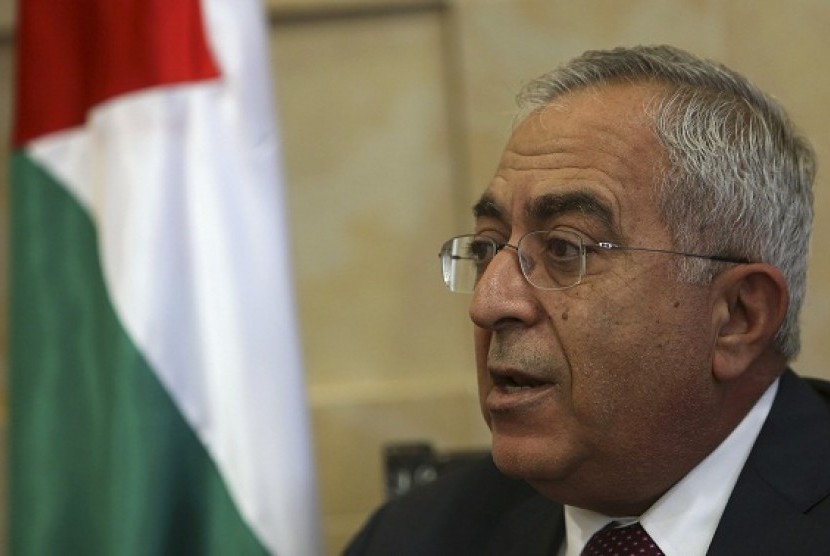 Palestinian Prime Minister Salam Fayyad speaks during an interview with Reuters in the West Bank city of Ramallah December 17, 2012. He says that sanction imposed by Israel puts about a million citizens in Palestine in the cycle of poverty.  