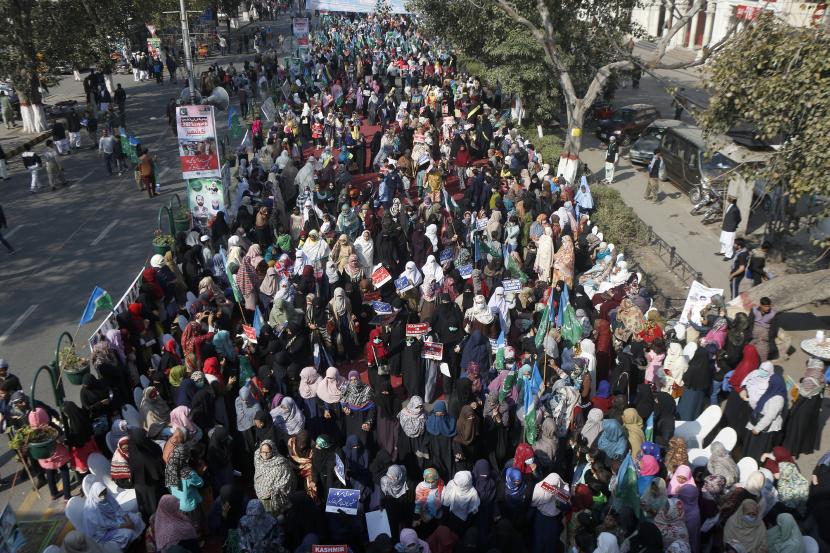 Supporters of the Pakistani religious group Jamaat-e-Islami participate in a demonstration to commemorate Kashmir Solidarity Day in Lahore, Pakistan, Friday, February 5, 2021. Pakistan's political and military leadership marked the annual Solidarity Day with Kashmir, vowing to continue political support for those living in the Indian-controlled part of Kashmir and for a solution to the status of the disputed territory in accordance with UN resolutions.