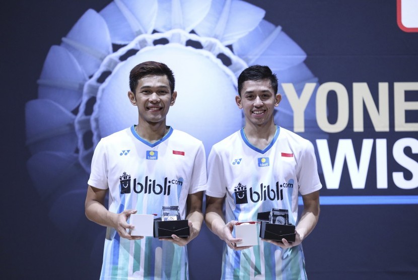 Pasangan ganda putra Indonesia Fajar Alfian (kiri) dan Muhammad Rian Ardianto menjuarai turnamen bulu tangkis Swiss Open 2019. BWF mengumumkan pembatalan Swiss Open 2020.