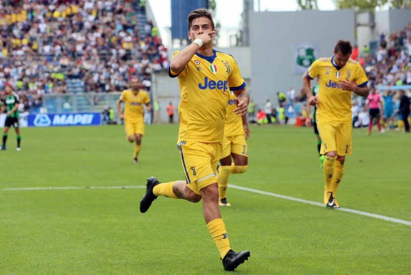 Paulo Dybala usai melesakkan gol ke gawang Sassuolo ketika Juventus FC meraih kemenangan 3-1 pada lanjutan Liga Italia Serie A di Stadion Mapei, Ahad ((17/9). Dyabala mencatat delapan gol dalam empat laga, untuk menandai penampilan ke-100 nya di Juve. 