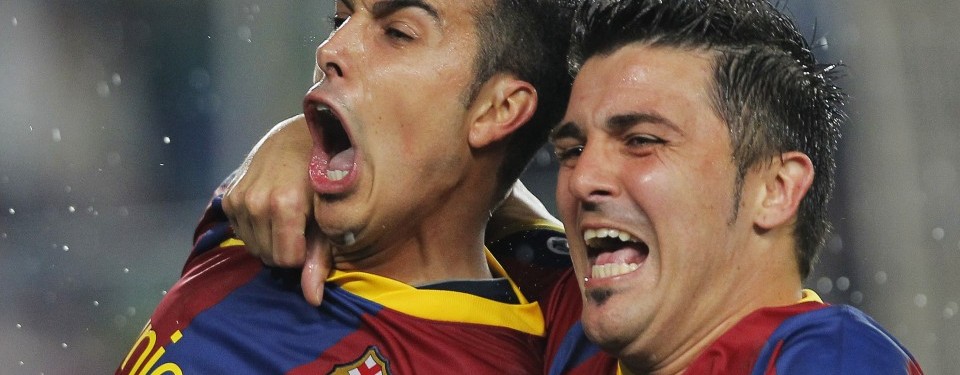 Pedro Rodriguez, striker Barcelona, bergembira bersama David Villa usai menggetarkan gawang Real Madrid.