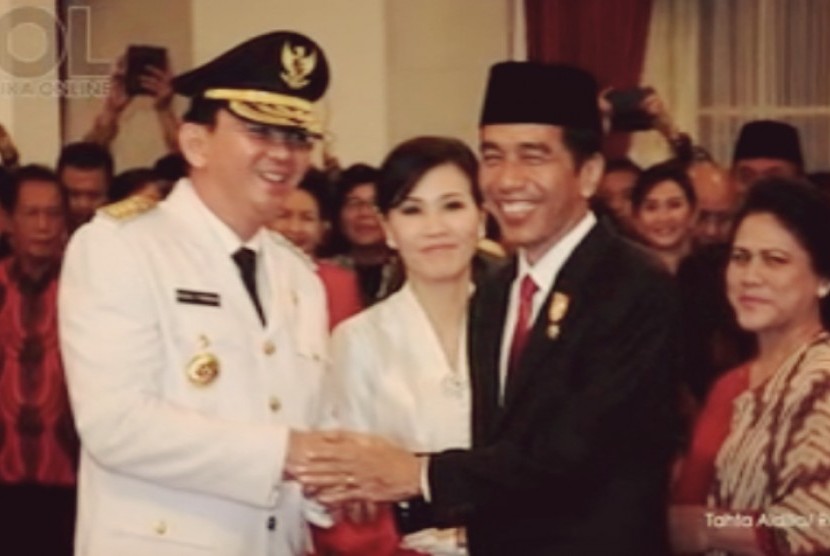 Governor of Jakarta Basuki Tjahja Purnama (left) poses with President Joko Widodo after the inauguration in Jakarta on Nov, 19.