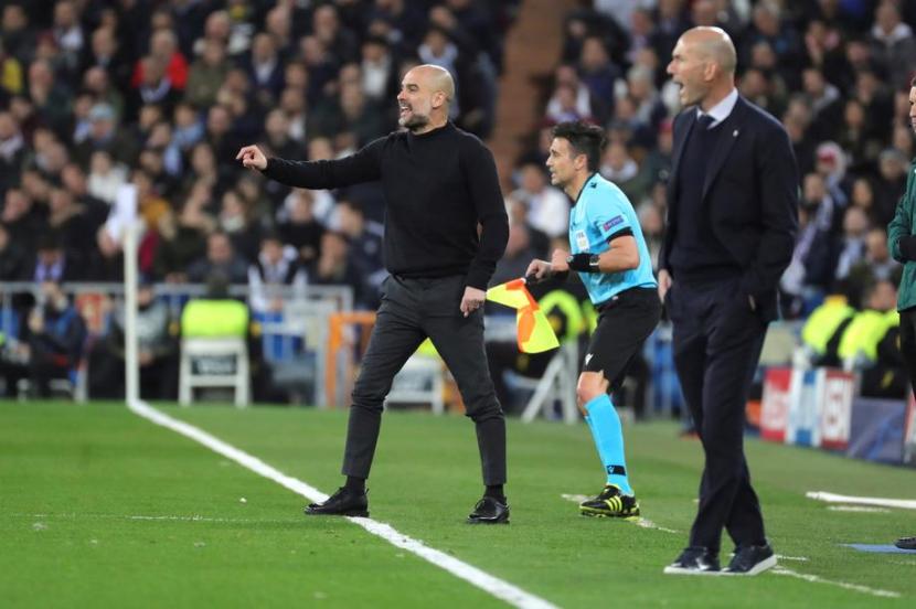 Pelatih Manchester City Pep Guardiola (kiri) dan pelatih Real Madrid Zinedine Zidane akan kembali beradu taktik pada leg kedua babak 16 besar Liga Champions di Stadion Etihad, Sabtu (8/8) dini hari WIB.