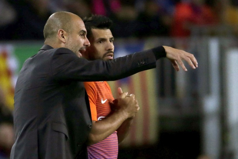 Pelatih Manchester City, Pep Guardiola (kiri) dan striker, Sergio Aguero.