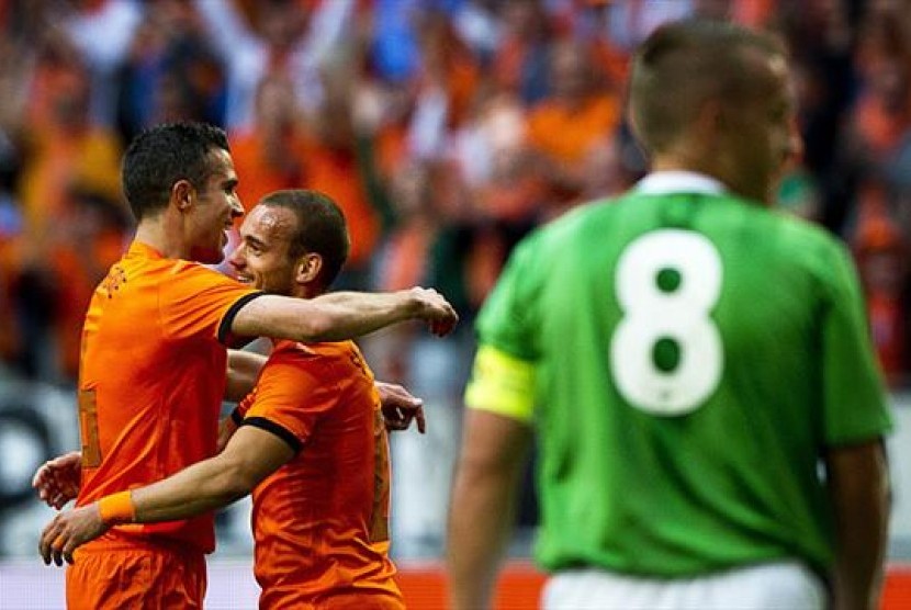 Pemain Belanda merayakan kemenangan